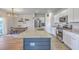 Modern kitchen featuring stainless steel appliances, a center island with a sink, granite countertops, and white cabinets at 307 Fox Gap Rd, Summerville, SC 29486