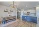 Open-concept kitchen and dining area featuring stainless steel appliances, an island, and hardwood floors at 307 Fox Gap Rd, Summerville, SC 29486