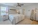 Spacious main bedroom featuring a ceiling fan, an ensuite bathroom, and a view of the lake at 307 Fox Gap Rd, Summerville, SC 29486