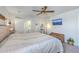 Bright main bedroom with an ensuite bathroom, ceiling fan, neutral walls, and carpeted flooring at 307 Fox Gap Rd, Summerville, SC 29486