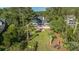 Aerial view of the house showing a screened porch, deck, and backyard bordered by mature trees at 3130 Pignatelli Cres, Mount Pleasant, SC 29466