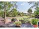 Backyard view from a deck featuring outdoor seating, and a view of a tree-filled lawn at 3130 Pignatelli Cres, Mount Pleasant, SC 29466