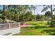 A lovely backyard featuring a spacious deck, an expansive grassy area, and mature trees at 3130 Pignatelli Cres, Mount Pleasant, SC 29466