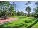 Enjoy the backyard views from the deck featuring outdoor dining and a green lawn at 3130 Pignatelli Cres, Mount Pleasant, SC 29466