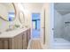 Bathroom features double sink, wood cabinets, and a walk-in shower at 3130 Pignatelli Cres, Mount Pleasant, SC 29466