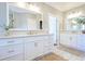 Bathroom showcasing dual sinks with white cabinetry and brushed nickel hardware fixtures at 3130 Pignatelli Cres, Mount Pleasant, SC 29466