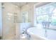 Bathroom showcasing a glass shower, soaking tub, and charming faucet at 3130 Pignatelli Cres, Mount Pleasant, SC 29466