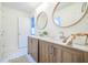 Bathroom features double sink, wood cabinets, and decorative circular mirrors at 3130 Pignatelli Cres, Mount Pleasant, SC 29466