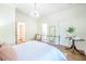 Bedroom with metal bed frame, wood floors, and a decorative chandelier at 3130 Pignatelli Cres, Mount Pleasant, SC 29466