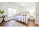 Bedroom featuring a metal bed frame, wood floors, and natural light at 3130 Pignatelli Cres, Mount Pleasant, SC 29466