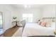 Cozy bedroom featuring wood floors, metal bed frame, and a vintage-style chandelier at 3130 Pignatelli Cres, Mount Pleasant, SC 29466