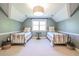 Comfortable bedroom featuring twin beds with striped bedding, a decorative light and light-green walls at 3130 Pignatelli Cres, Mount Pleasant, SC 29466