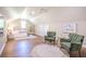Spacious bedroom with wood floors, sitting area, a queen bed, and natural light from a window at 3130 Pignatelli Cres, Mount Pleasant, SC 29466