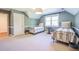 Cozy bedroom featuring two twin beds, a decorative light fixture and a large window for natural light at 3130 Pignatelli Cres, Mount Pleasant, SC 29466