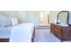 Cozy bedroom featuring soft, neutral carpet, and an antique dresser with mirror at 3130 Pignatelli Cres, Mount Pleasant, SC 29466