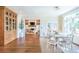 Bright dining area with wood floors and a view into the living room at 3130 Pignatelli Cres, Mount Pleasant, SC 29466