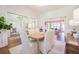 Bright dining room featuring hardwood floors, a woven table and views of other living spaces at 3130 Pignatelli Cres, Mount Pleasant, SC 29466
