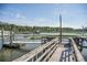 Well-maintained private dock with boat lifts and serene water views at 3130 Pignatelli Cres, Mount Pleasant, SC 29466