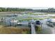 Beautiful aerial view of boat docks on a serene waterfront, ideal for boating enthusiasts at 3130 Pignatelli Cres, Mount Pleasant, SC 29466