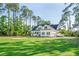 Charming two-story home with black shutters, lush green lawn, and mature trees at 3130 Pignatelli Cres, Mount Pleasant, SC 29466