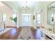Bright foyer featuring hardwood floors, elegant chandelier, and a view into adjacent rooms at 3130 Pignatelli Cres, Mount Pleasant, SC 29466