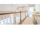 Open hallway featuring white railing with dark wood trim and light-colored walls at 3130 Pignatelli Cres, Mount Pleasant, SC 29466