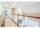 Hallway featuring white railing with dark wood trim, light-colored walls, and view to lower level at 3130 Pignatelli Cres, Mount Pleasant, SC 29466