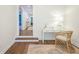 Bright hallway with hardwood floors, white walls, a desk, and a decorative chair at 3130 Pignatelli Cres, Mount Pleasant, SC 29466