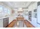 Charming kitchen featuring white cabinets, stainless steel appliances, and a wood-topped island at 3130 Pignatelli Cres, Mount Pleasant, SC 29466