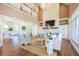 Spacious living room with vaulted ceilings, stone fireplace, and views into the dining room at 3130 Pignatelli Cres, Mount Pleasant, SC 29466