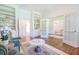 Open-concept living room with hardwood floors, built-in storage, and view into other rooms at 3130 Pignatelli Cres, Mount Pleasant, SC 29466