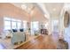 Bright, open living room with a vaulted ceiling, hardwood floors, and large windows at 3130 Pignatelli Cres, Mount Pleasant, SC 29466