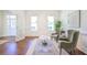 Elegant living room featuring hardwood floors, neutral decor, and a cozy seating arrangement at 3130 Pignatelli Cres, Mount Pleasant, SC 29466