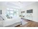 Airy main bedroom with large windows, porch access, and a cozy armchair seating area at 3130 Pignatelli Cres, Mount Pleasant, SC 29466