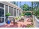Enjoy the outdoor living space with comfortable seating, a screened porch, and a pergola-covered hot tub at 3130 Pignatelli Cres, Mount Pleasant, SC 29466