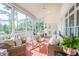 Comfortable screened porch with wicker furniture, ceiling fan, and a view of the exterior at 3130 Pignatelli Cres, Mount Pleasant, SC 29466