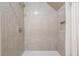 Elegant tiled shower featuring neutral-colored subway tiles, a shower niche, and a modern showerhead at 3130 Pignatelli Cres, Mount Pleasant, SC 29466