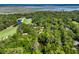 Scenic aerial view showcases a golf course community nestled by a river and the ocean at 33 Painted Bunting Ln, Kiawah Island, SC 29455