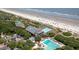 High angle view of beachside resort featuring pools, private parking and ocean views at 33 Painted Bunting Ln, Kiawah Island, SC 29455