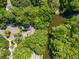 Overhead view of a home nestled in lush greenery, bordering a peaceful waterway at 33 Painted Bunting Ln, Kiawah Island, SC 29455