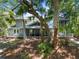 Charming home featuring a screened porch and backyard deck nestled among the palms at 33 Painted Bunting Ln, Kiawah Island, SC 29455