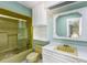 Retro bathroom with a tiled shower, matching toilet and sink, and built in storage at 33 Painted Bunting Ln, Kiawah Island, SC 29455