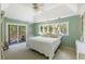 This bedroom has natural light and a balcony with relaxing outdoor seating at 33 Painted Bunting Ln, Kiawah Island, SC 29455