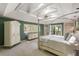 Spacious bedroom featuring a vaulted ceiling, a bed, and windows with a balcony at 33 Painted Bunting Ln, Kiawah Island, SC 29455