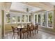 Bright dining area with large windows and a ceiling fan, perfect for enjoying meals at 33 Painted Bunting Ln, Kiawah Island, SC 29455