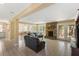 Inviting living space with stone fireplace, tile flooring, and abundant natural light at 33 Painted Bunting Ln, Kiawah Island, SC 29455