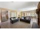 Open-concept living room with comfortable seating, tile floors, and seamless flow to the dining area at 33 Painted Bunting Ln, Kiawah Island, SC 29455