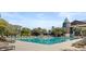 Gorgeous community pool with ample lounge chairs and lush landscaping under a bright sky at 33 Painted Bunting Ln, Kiawah Island, SC 29455