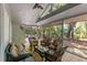 Inviting screened-in porch with views of the lush surroundings at 33 Painted Bunting Ln, Kiawah Island, SC 29455