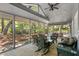Spacious screened-in porch with comfortable seating and a scenic view at 33 Painted Bunting Ln, Kiawah Island, SC 29455